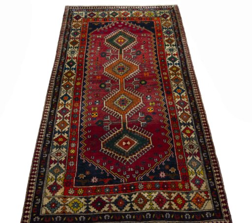 Surface texture of 2000s Shiraz rug with natural Wool and intricate pattern