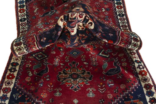 Corner detail of 2000s Shiraz rug showing border pattern and Wool pile