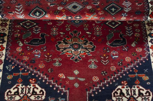Full view of 2000s Shiraz rug from Iran / Persia, 190 × 110 cm in Red tones