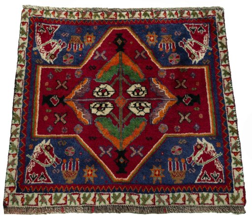 Surface texture of 2000s Shiraz rug with natural Wool and intricate pattern