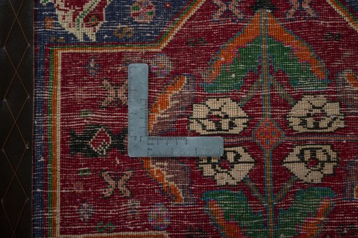 Backside of handmade 2000s Shiraz rug showing knot structure and weave density
