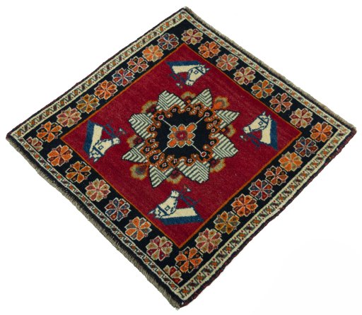 Corner detail of 2000s Shiraz rug showing border pattern and Wool pile
