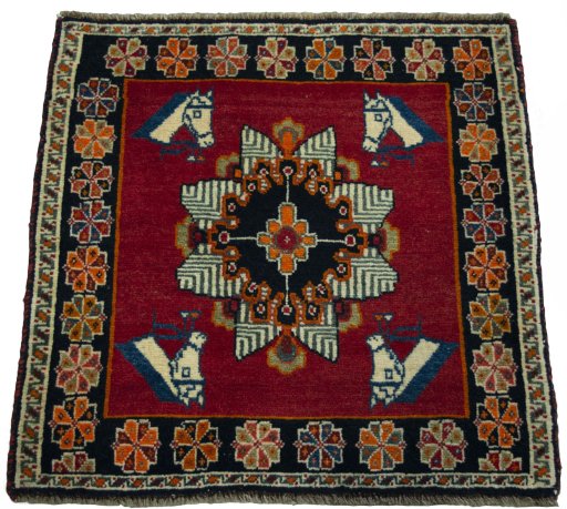 Surface texture of 2000s Shiraz rug with natural Wool and intricate pattern