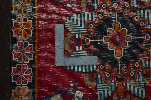 Backside of handmade 2000s Shiraz rug showing knot structure and weave density