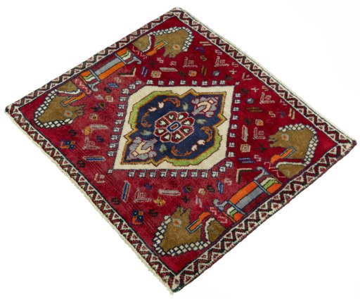 Corner detail of 2000s Shiraz rug showing border pattern and Wool pile