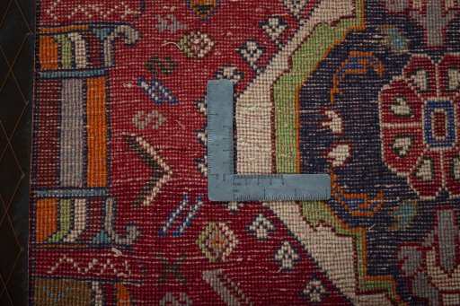 Backside of handmade 2000s Shiraz rug showing knot structure and weave density