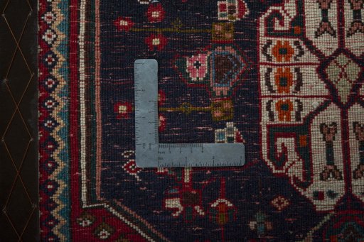 Backside of handmade 2000s Shiraz rug showing knot structure and weave density