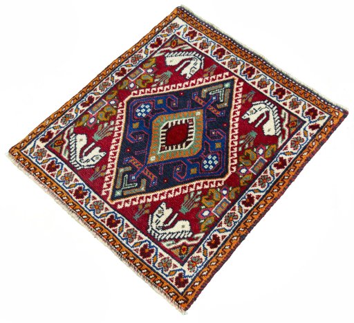 Corner detail of 2000s Shiraz rug showing border pattern and Wool pile