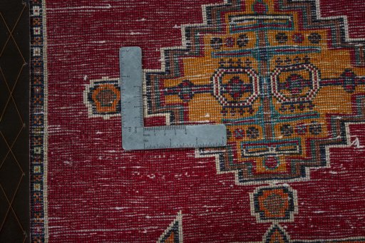 Backside of handmade 2000s Shiraz rug showing knot structure and weave density