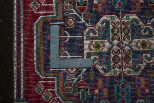 Backside of handmade 2000s Shiraz rug showing knot structure and weave density