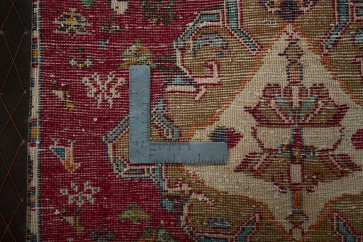 Backside of handmade 2000s Shiraz rug showing knot structure and weave density