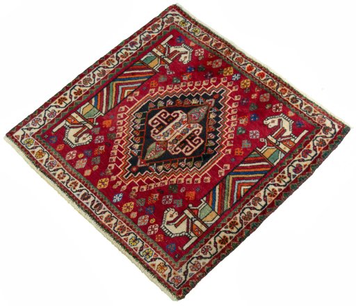 Corner detail of 2000s Shiraz rug showing border pattern and Wool pile