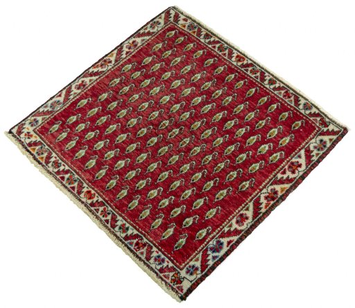 Corner detail of 2000s Shiraz rug showing border pattern and Wool pile