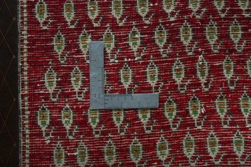 Backside of handmade 2000s Shiraz rug showing knot structure and weave density