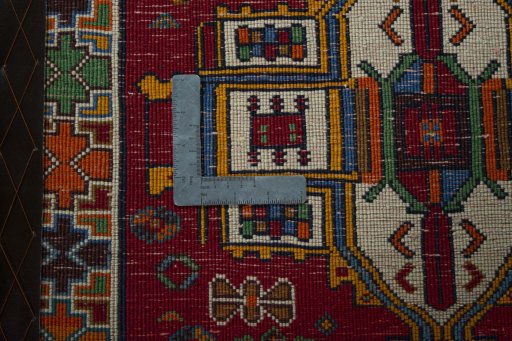 Backside of handmade 2000s Shiraz rug showing knot structure and weave density