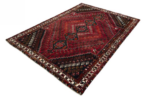 Corner detail of 2000s Shiraz rug showing border pattern and Wool pile