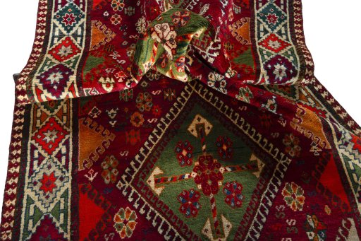 Corner detail of 2000s Shiraz rug showing border pattern and Wool pile