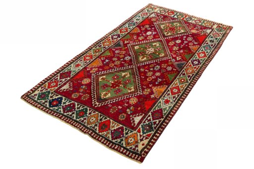 Corner detail of 2000s Shiraz rug showing border pattern and Wool pile