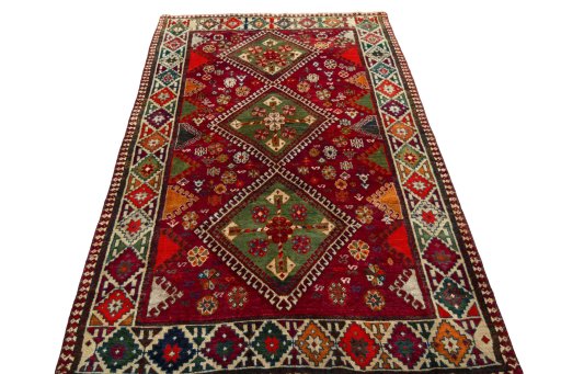 Surface texture of 2000s Shiraz rug with natural Wool and intricate pattern