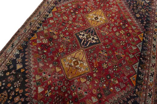 Backside of handmade 2000s Shiraz rug showing knot structure and weave density