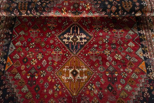 Full view of 2000s Shiraz rug from Iran / Persia, 278 × 176 cm in Red tones