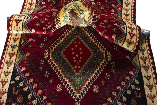 Corner detail of 2000s Shiraz rug showing border pattern and Wool pile
