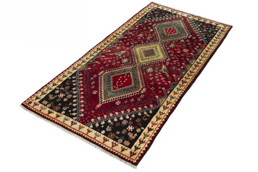 Corner detail of 2000s Shiraz rug showing border pattern and Wool pile