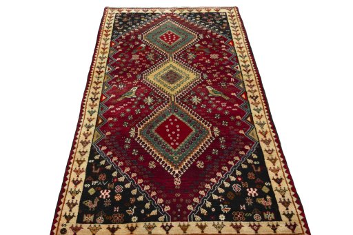 Surface texture of 2000s Shiraz rug with natural Wool and intricate pattern