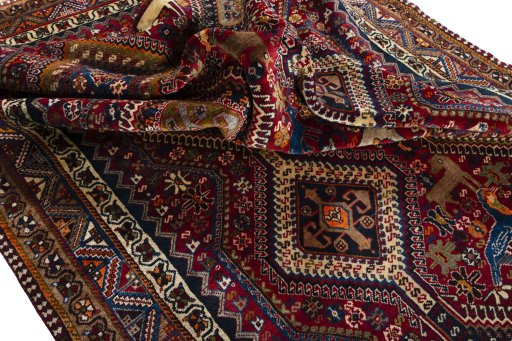 Corner detail of 2000s Shiraz rug showing border pattern and Wool pile