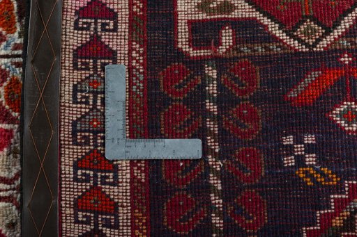 Surface texture of 2000s Shiraz rug with natural Wool and intricate pattern