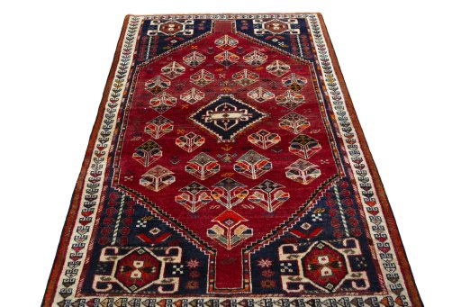Surface texture of 2000s Shiraz rug with natural Wool and intricate pattern