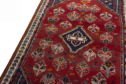 Backside of handmade 2000s Shiraz rug showing knot structure and weave density