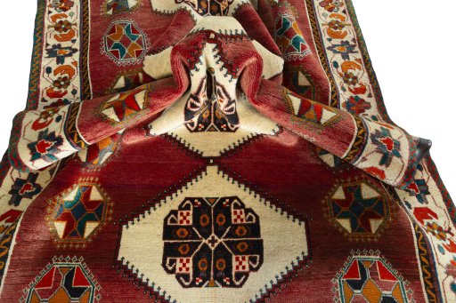 Corner detail of 2000s Shiraz rug showing border pattern and Wool pile