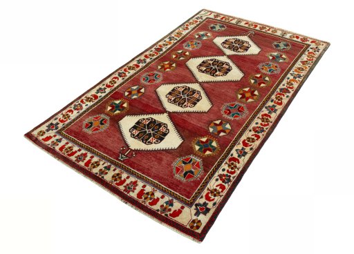 Corner detail of 2000s Shiraz rug showing border pattern and Wool pile