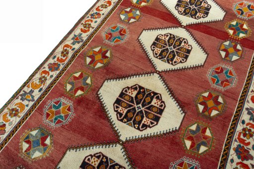 Backside of handmade 2000s Shiraz rug showing knot structure and weave density