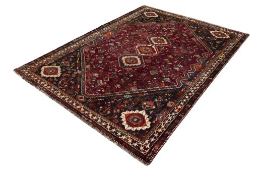 Corner detail of 2000s Shiraz rug showing border pattern and Wool pile
