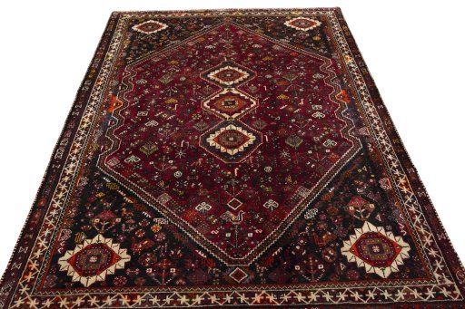 Surface texture of 2000s Shiraz rug with natural Wool and intricate pattern