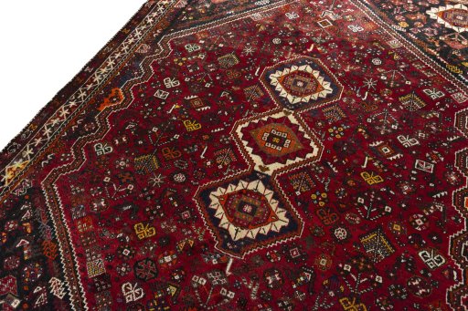 Backside of handmade 2000s Shiraz rug showing knot structure and weave density