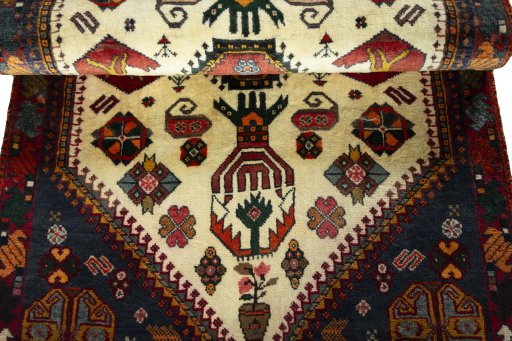 Corner detail of 2000s Shiraz rug showing border pattern and Wool pile