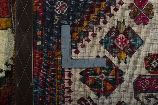 Surface texture of 2000s Shiraz rug with natural Wool and intricate pattern