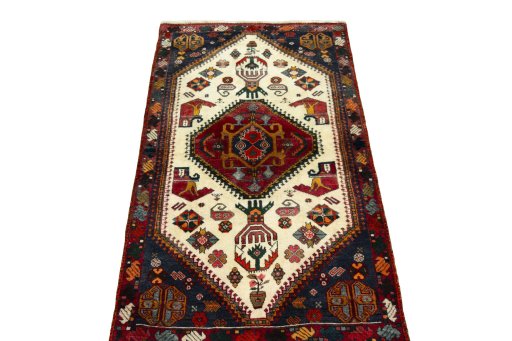 Surface texture of 2000s Shiraz rug with natural Wool and intricate pattern