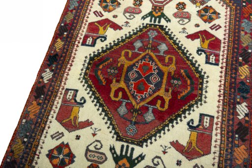 Backside of handmade 2000s Shiraz rug showing knot structure and weave density