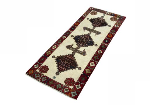 Corner detail of 2000s Shiraz rug showing border pattern and Wool pile