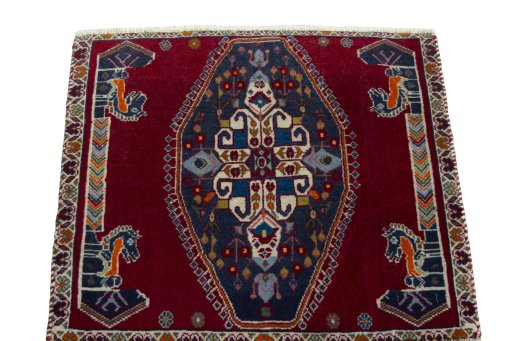 Surface texture of 2000s Shiraz rug with natural Wool and intricate pattern