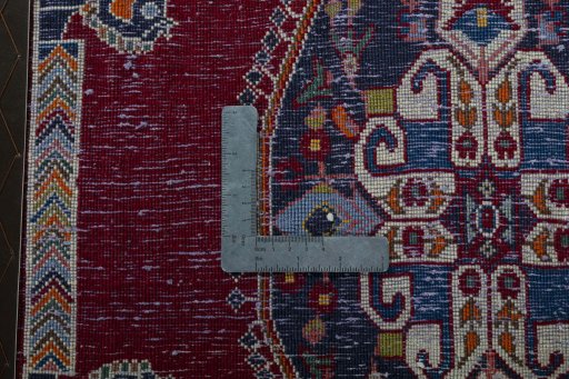 Backside of handmade 2000s Shiraz rug showing knot structure and weave density