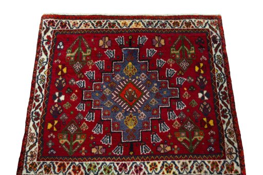 Surface texture of 2000s Shiraz rug with natural Wool and intricate pattern
