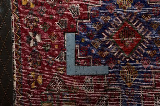 Backside of handmade 2000s Shiraz rug showing knot structure and weave density