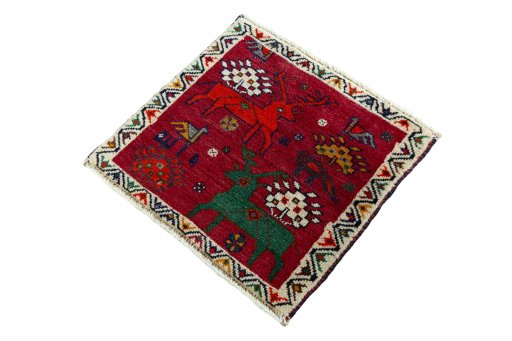 Corner detail of 2000s Shiraz rug showing border pattern and Wool pile