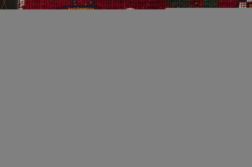 Backside of handmade 2000s Shiraz rug showing knot structure and weave density