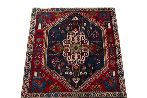 Surface texture of 2000s Shiraz rug with natural Wool and intricate pattern